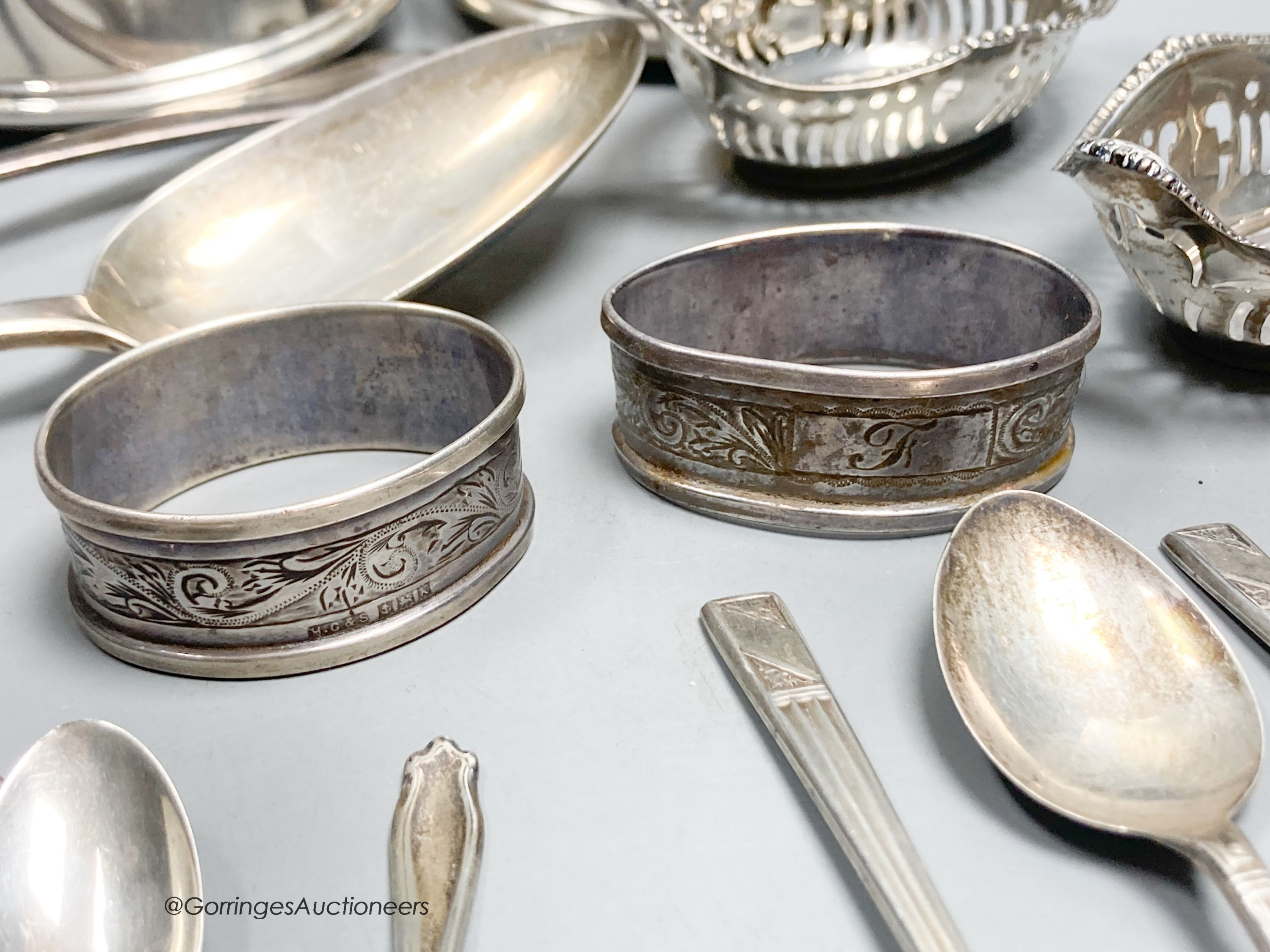 A pair of George III silver tablespoons, a pair of modern silver bottle coasters, a pair of pierced silver bon bon dishes, six silver teaspoons and 6 silver coffee spoons.